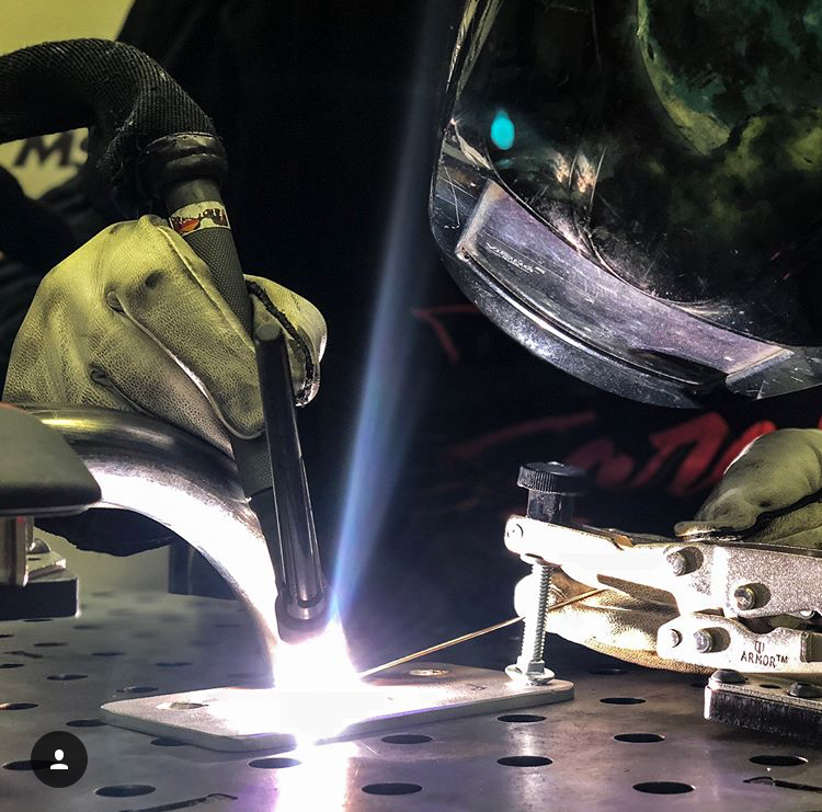 Welder Using Internal Threaded Bolt Retainers Tig Welding